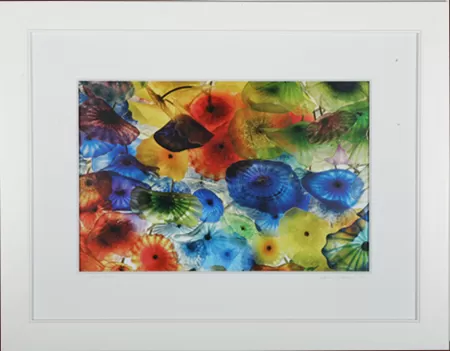 Framed floral artwork with a wide white mat, illustrating work for interior designers
